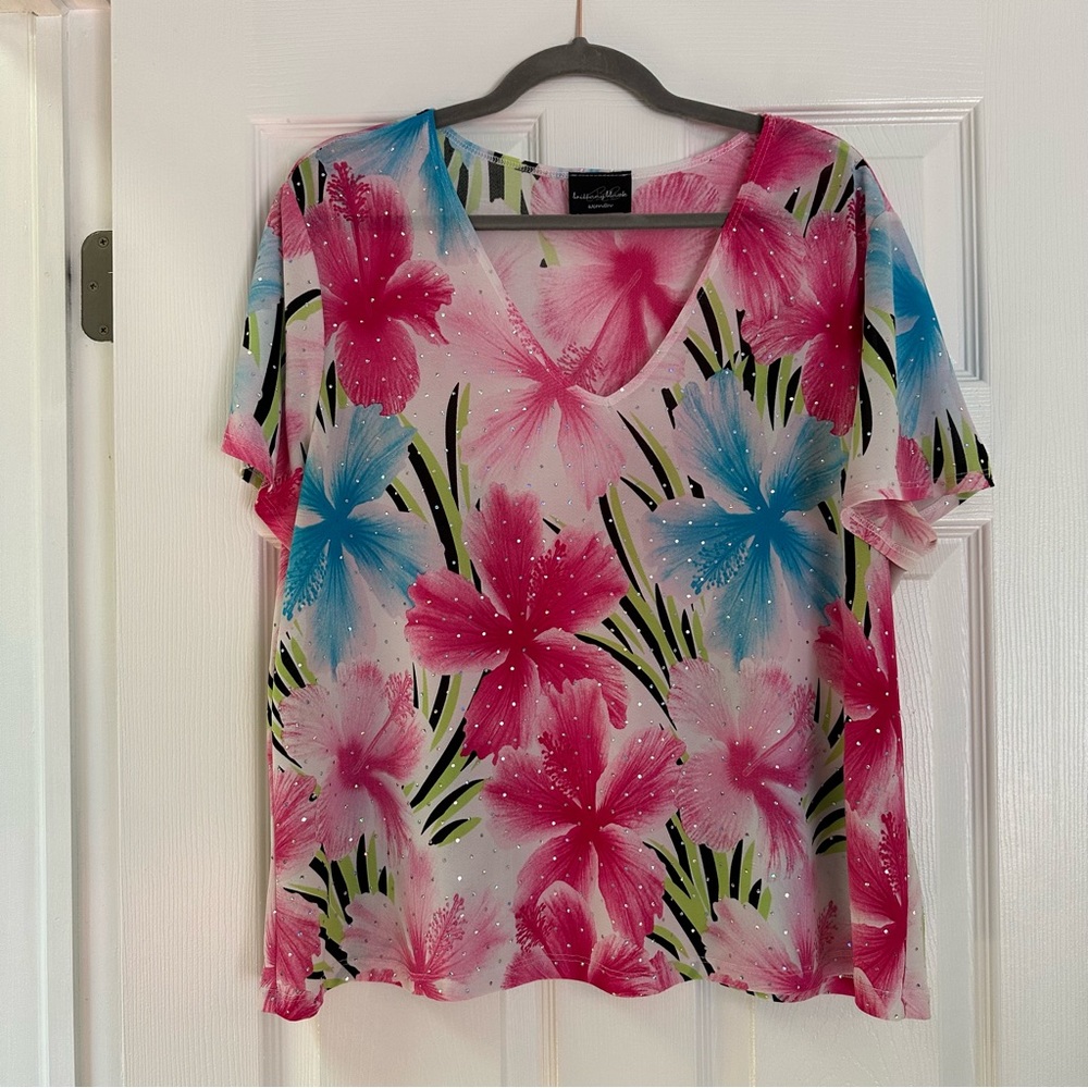 White v-neck tee with neon pink, blue, green floral print, sequin appliques